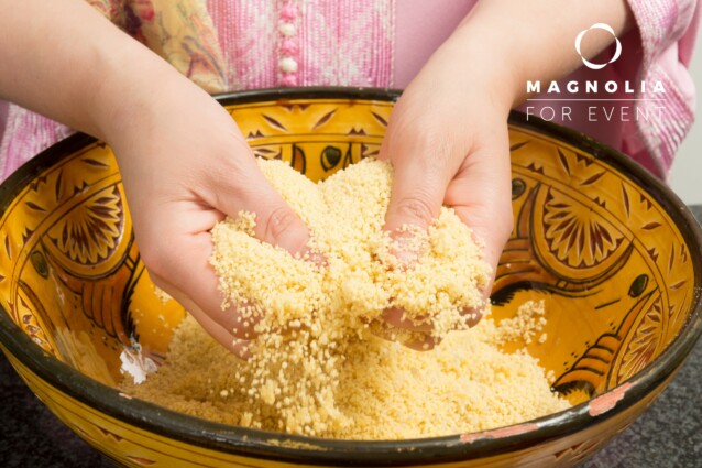 Traditional Moroccan immigrant woman in Europe cooking couscous during Ramadan