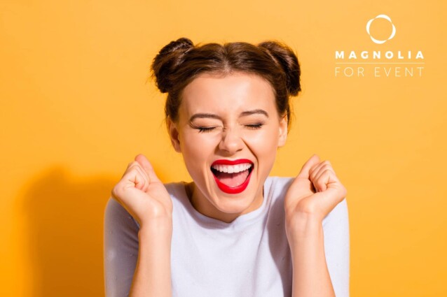 Close-up portrait of her she nice attractive fascinating lovely cheerful cheery crazy glam girl holding fists hope luck great success isolated over bright vivid shine yellow background.